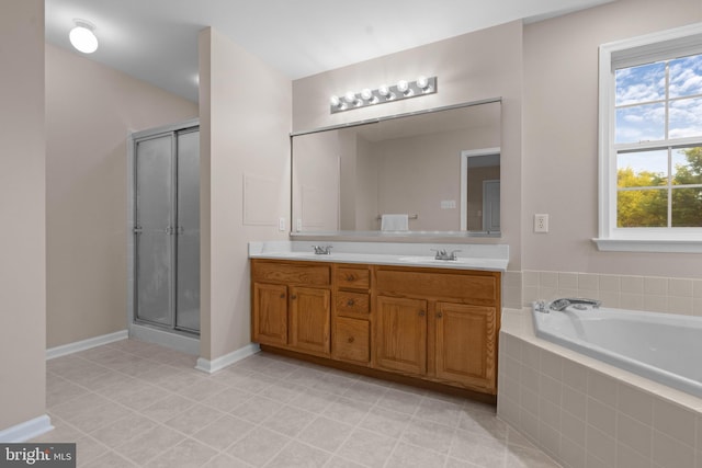full bathroom with a sink, a bath, a shower stall, and double vanity