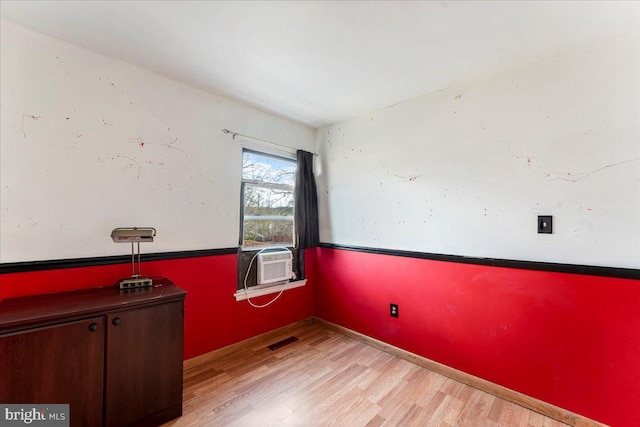 empty room with light hardwood / wood-style floors