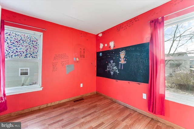 empty room featuring hardwood / wood-style flooring