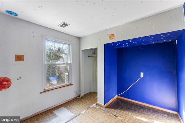 spare room with parquet floors