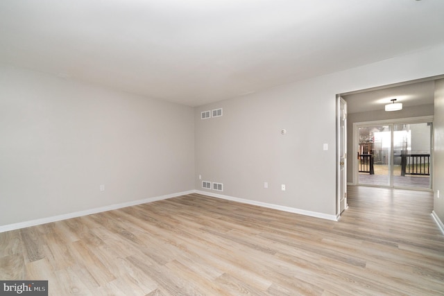 unfurnished room with visible vents, baseboards, and light wood-style flooring