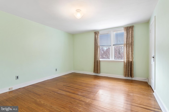 empty room with wood-type flooring