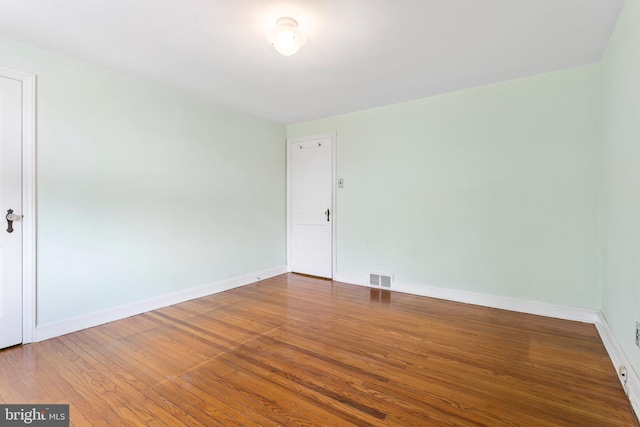 empty room with wood-type flooring