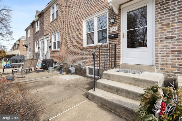 doorway to property with a patio