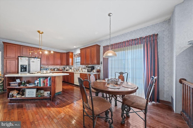 dining area with dark hardwood / wood-style floors