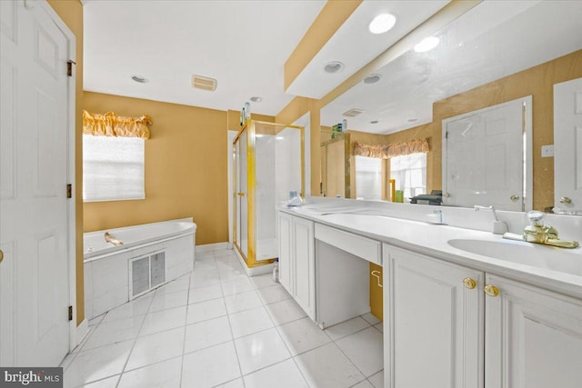 bathroom with plus walk in shower, tile patterned flooring, and vanity