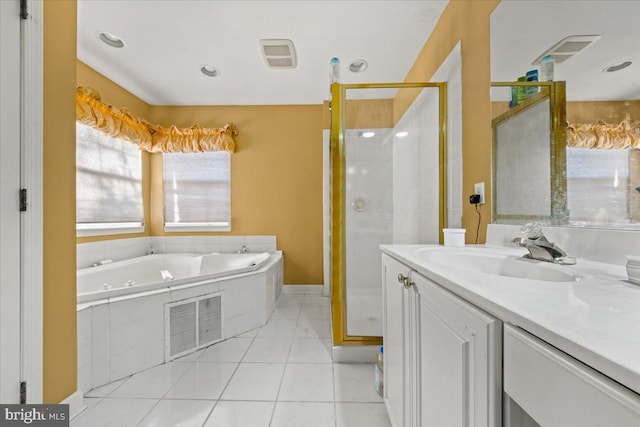 bathroom featuring shower with separate bathtub, tile patterned flooring, and vanity