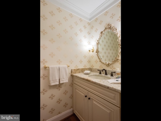 bathroom featuring crown molding and vanity