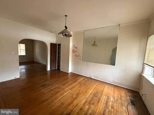 empty room with hardwood / wood-style floors