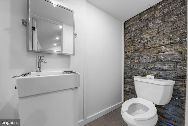 bathroom with vanity, tile patterned flooring, and toilet