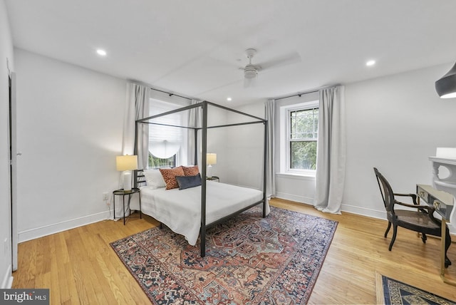 bedroom featuring hardwood / wood-style flooring and ceiling fan