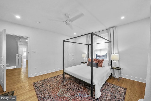 bedroom with hardwood / wood-style flooring and ceiling fan