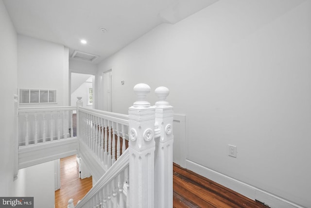 corridor with dark hardwood / wood-style floors