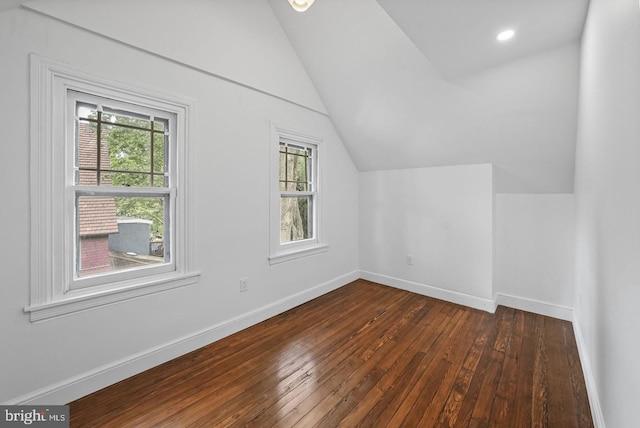 bonus room featuring lofted ceiling and dark wood-type flooring