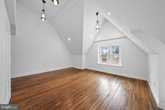 additional living space with dark wood-type flooring and vaulted ceiling