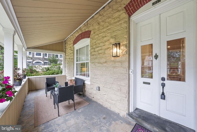 doorway to property with covered porch