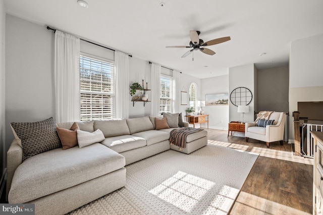 living room featuring ceiling fan and wood finished floors