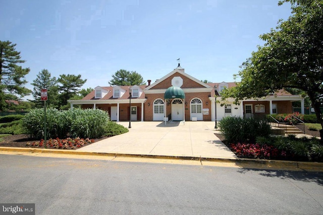 view of front of house featuring brick siding