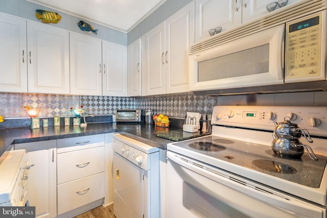 kitchen featuring backsplash, white appliances, light hardwood / wood-style flooring, and white cabinets