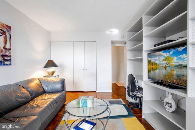 living area with parquet floors