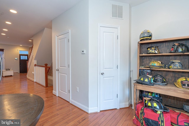 corridor featuring light hardwood / wood-style floors
