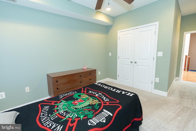 bedroom with carpet, a closet, and ceiling fan