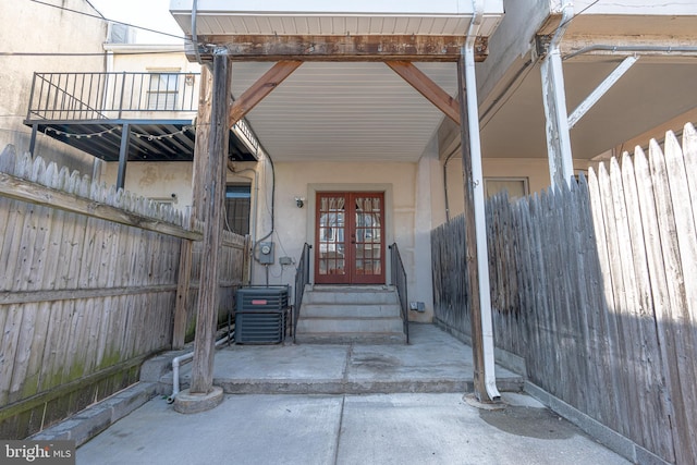 doorway to property with french doors and central AC