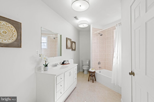 bathroom featuring visible vents, toilet, shower / tub combo with curtain, tile patterned flooring, and vanity