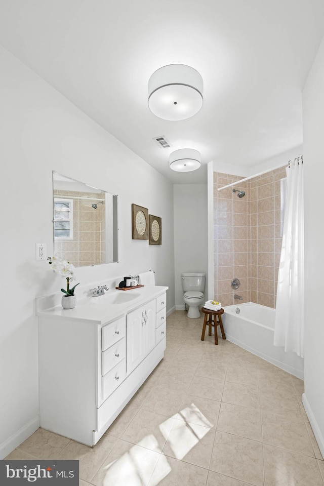 full bathroom with shower / tub combo with curtain, toilet, vanity, baseboards, and tile patterned floors