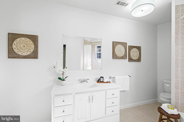 full bath with toilet, vanity, visible vents, baseboards, and tile patterned floors