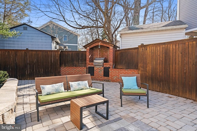 view of patio / terrace featuring outdoor lounge area, area for grilling, and a fenced backyard