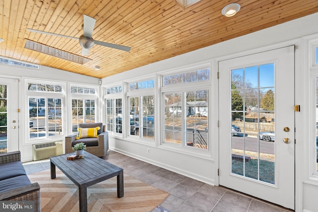 sunroom with wooden ceiling, vaulted ceiling, a wealth of natural light, and a wall mounted air conditioner