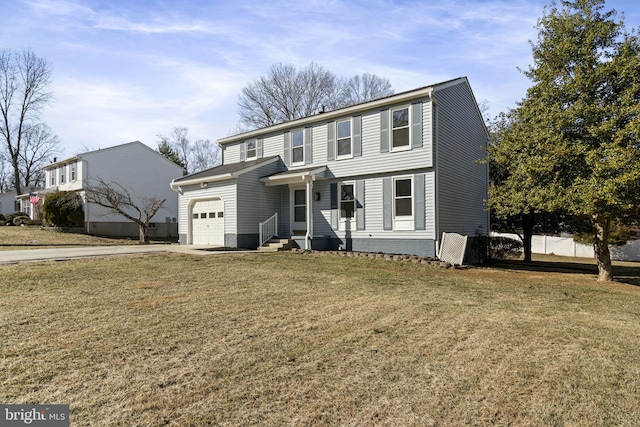 view of front facade featuring entry steps, an attached garage, and a front yard