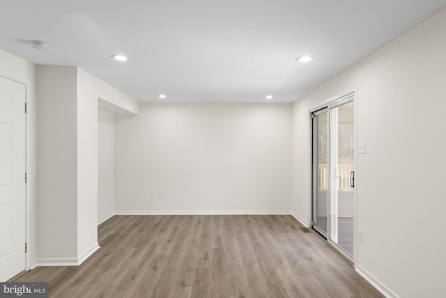 interior space featuring baseboards, recessed lighting, and light wood-style floors