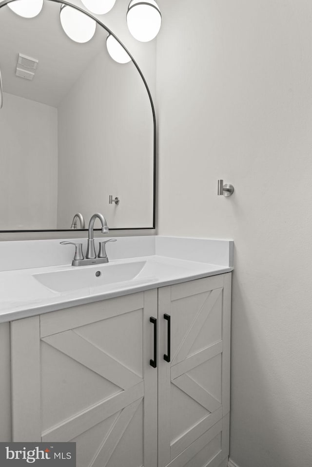 bathroom with visible vents and vanity