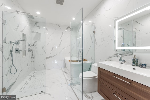 bathroom with toilet, stone wall, visible vents, and vanity