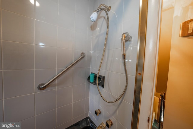 full bathroom with a tile shower