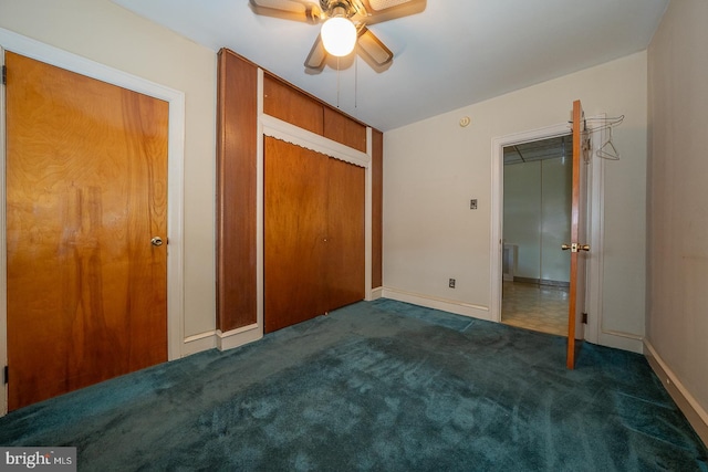 unfurnished bedroom featuring ceiling fan, a closet, carpet flooring, and baseboards