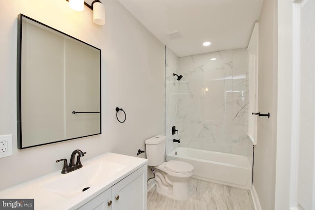 full bathroom with tiled shower / bath combo, vanity, and toilet