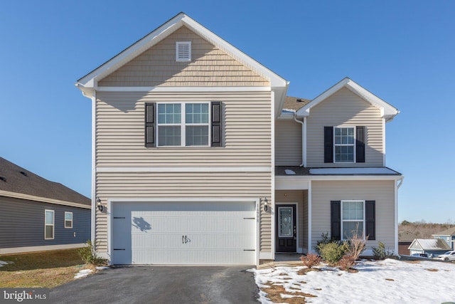 front of property with a garage