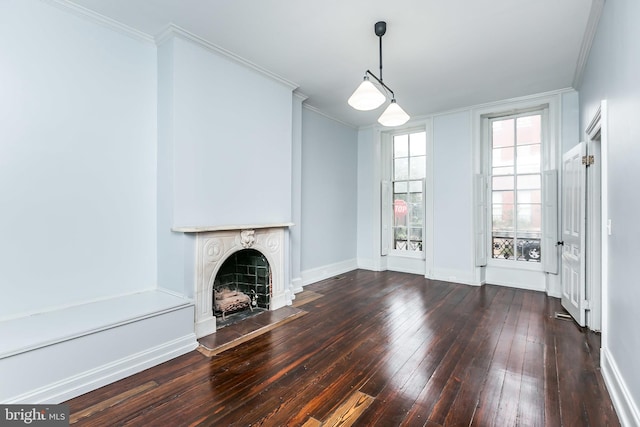 unfurnished living room with crown molding, a fireplace, baseboards, and hardwood / wood-style flooring