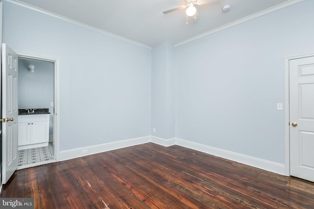 unfurnished room with baseboards, ornamental molding, ceiling fan, and dark wood-type flooring