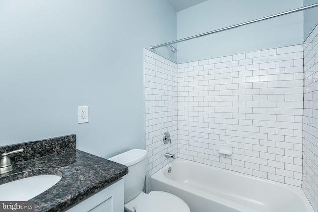 bathroom featuring toilet, bathing tub / shower combination, and vanity