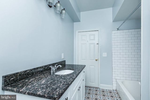 full bathroom featuring shower / washtub combination, vanity, and baseboards