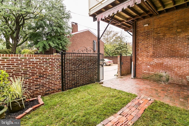 view of yard featuring fence and a gate