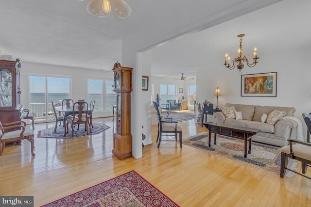 3 Ingram Bay Dr, Heathsville, VA 22473 - living area featuring ceiling fan with notable chandelier and light wood finished floors