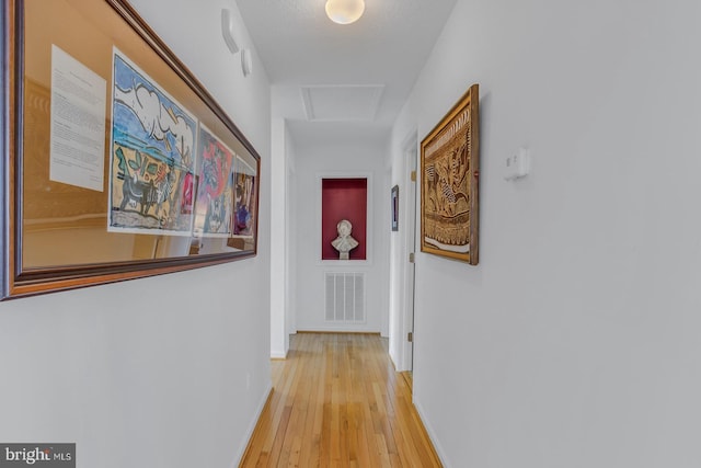 3 Ingram Bay Dr, Heathsville, VA 22473 - corridor featuring baseboards, visible vents, light wood-style floors, and attic access