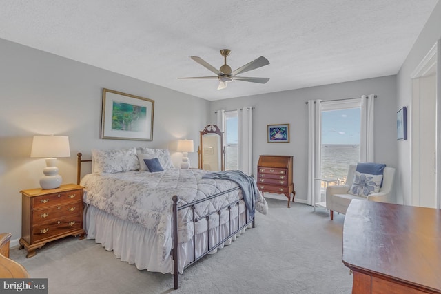 3 Ingram Bay Dr, Heathsville, VA 22473 - bedroom with a textured ceiling, access to outside, a ceiling fan, and light carpet