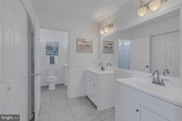 3 Ingram Bay Dr, Heathsville, VA 22473 - full bathroom featuring toilet, a sink, two vanities, and tile patterned flooring