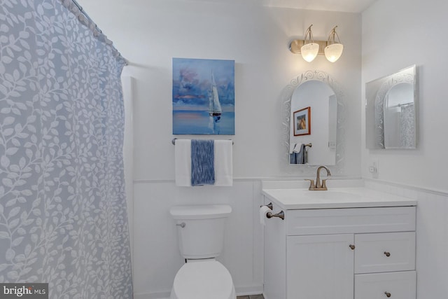 3 Ingram Bay Dr, Heathsville, VA 22473 - bathroom featuring a wainscoted wall, curtained shower, toilet, and vanity